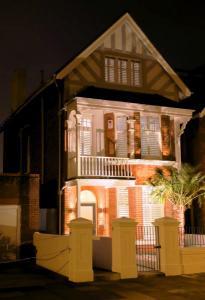Night home lit up with beautiful shutters