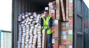 Warehouse staff unloading trade shutters